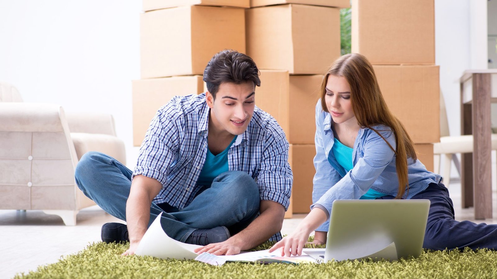 Physician planning a move to Florida with a map and moving boxes